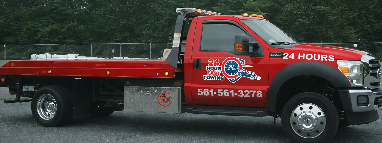 Red 24 Hour Fast Towing truck
